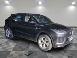 the black suv is parked on a checkered floor in the garage