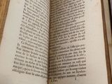an open book that is sitting on a table