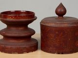 two wooden containers sitting on a table next to each other