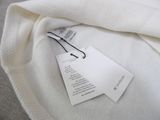 a white tag on a white shirt with a tag attached to it