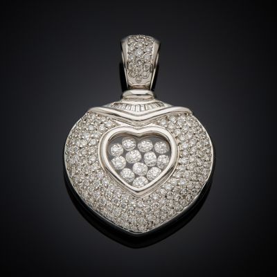 a heart shaped diamond pendant on a black background