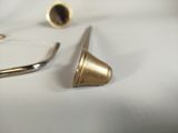 a pair of scissors and a pair of earplugs on a table