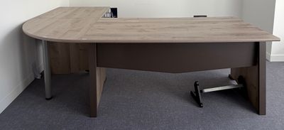 an image of a desk in an office with a phone on it