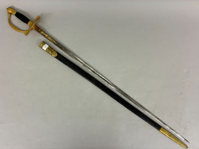 un gros plan d'une épée posée sur une surface blanche, avec une poignée noire