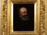 portrait of a man with a beard in a gold frame
