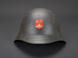 a close up of a helmet with a coat of arms on it