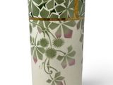 a vase with a green and white design on it