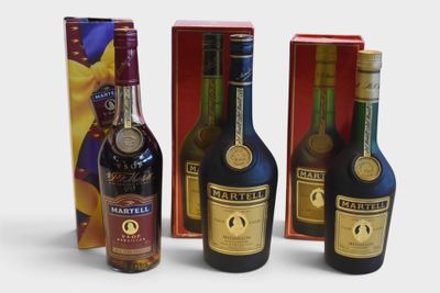 three bottles of wine are sitting next to a box of wine