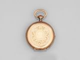 une montre de poche ancienne en or, dont le cadran représente le visage d'une femme