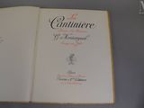 an open book that has a picture of a cat on it