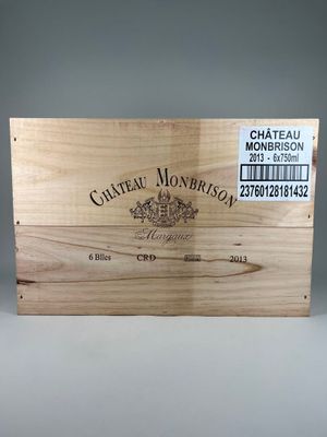 une boîte en bois vide portant une étiquette « Château Monois »