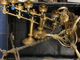 a gold menorat with a clock on top of it