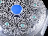 an image of a glass box with a blue stone in it