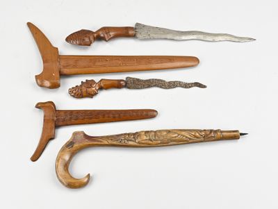 several different types of knives are lined up on a white surface