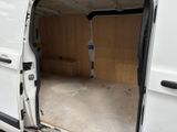 a white van with a door open on the side of the road