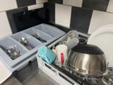 an image of a kitchen with dishes and utensils on the stove