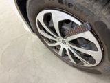 a close up of a tire with a measuring tape on it