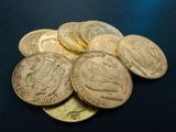 a pile of coins sitting on top of a table