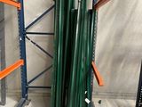 a stack of green pipes sitting on a shelf