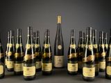 bottles of champagne lined up in a row on a table