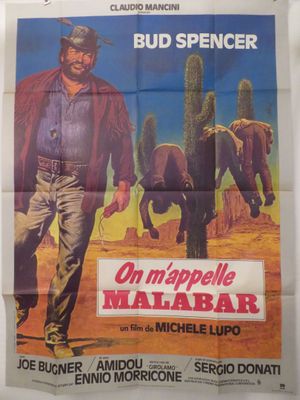 une vieille affiche de cinéma représentant un homme marchant dans le désert