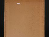 an empty box sitting on top of a black shelf next to a white wall