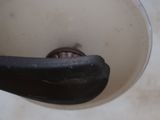 a close up view of a black handle on a sink faucet