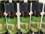 a close up of a bunch of bottles of essential oils on a table