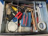 a tool box with many tools in it on the floor