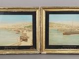 two framed pictures of boats on the water with a city in the background