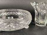 crystal bowl and candle holder on a black surface