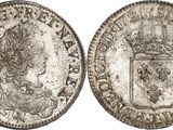 a silver coin with a crown on the front and a crown on the back