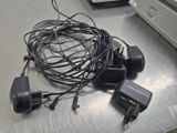 a bunch of wires and plugs on a table