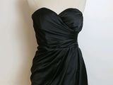 strapless black cocktail dress on a mannequin dummy