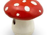 a red and white mushroom with white spots on it
