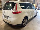 a picture of a white car parked in a garage