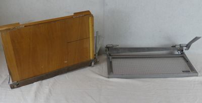 two pieces of wood and metal on a table