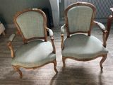 two chairs sitting next to each other on the floor