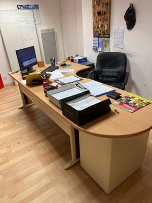a desk with a laptop and a monitor on it