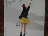 a poster with a picture of a girl on top of a box