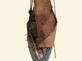 a small boat that is hanging from a rope