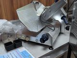 an image of a commercial pizza cutter on a counter