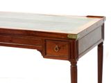 a wooden desk with a glass top and a drawer