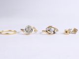 a set of three gold rings with diamonds on them
