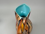 a small vase that is sitting on a table