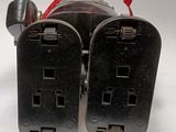 two plugs that are connected to each other on a table