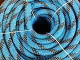 a close up of a blue hose in a cardboard box