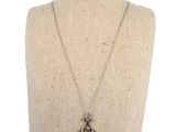 a close up of a mannequin torso with a necklace on it