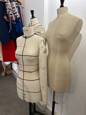 two mannequins on display in a clothing store