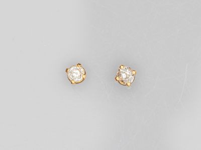 a pair of diamond stud earrings